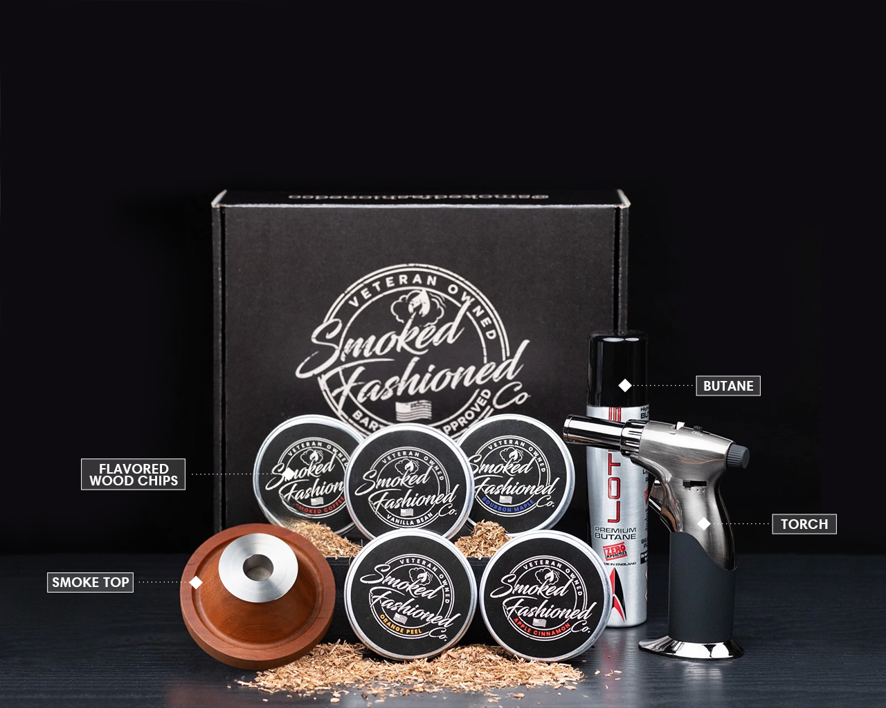 Smoked Fashioned cocktail smoker kit setup with wood chips and torch