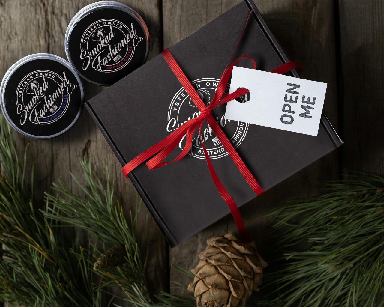 A holiday gift box featuring a Smoked Fashioned kit with cocktail accessories