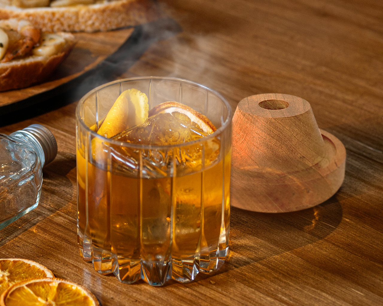 Smoked maple bourbon smash served in a festive glass