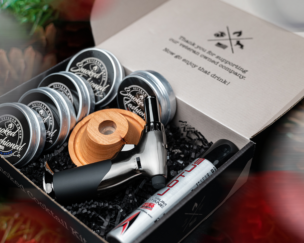 Holiday-themed smoker kits and accessories, perfect for cocktail lovers.